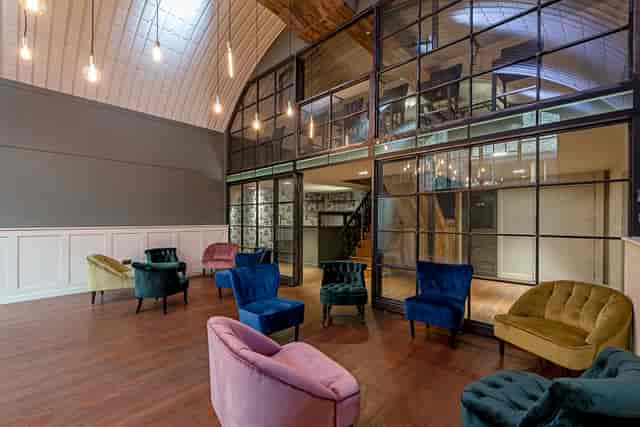 Sophisticated meeting space with plush chairs, ideal for conferences and events.