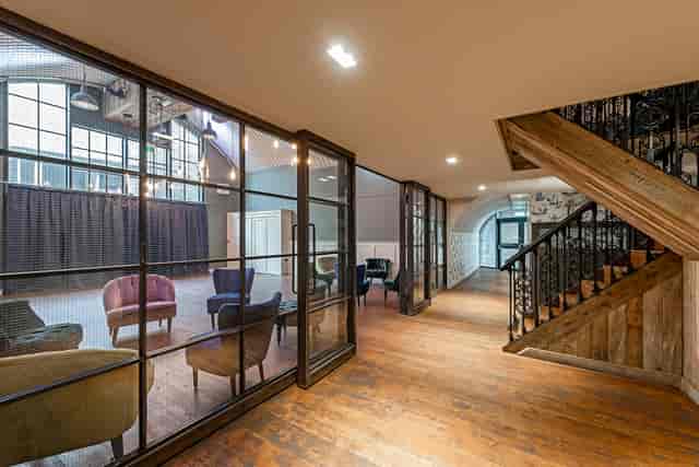 Stylish event space at Rae's with wooden flooring for meetings and gatherings.