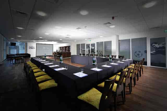 Banks Lounge at Leicester City FC: modern meeting room for corporate events with projector.