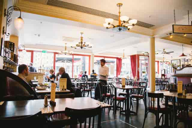 Spacious Café Rouge venue with natural light, ideal for meetings and events.