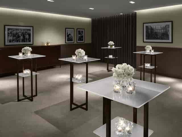 Sophisticated event space with high-top tables, ideal for networking and cocktail receptions.