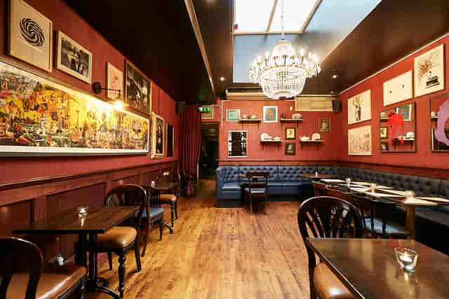 Intimate restaurant venue with elegant chandelier for private events in Little Bat.