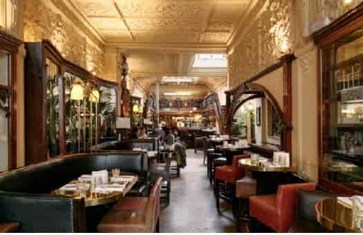 Elegant Browns Mayfair restaurant venue for upscale events, featuring cozy seating and natural light.