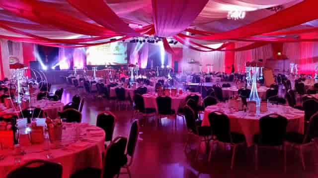 Bath Pavilion gala: elegant ceiling draping and stage lighting for large-scale corporate events.