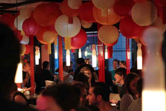 Vibrant event space with colorful lanterns for networking and socializing at Yauatcha City.