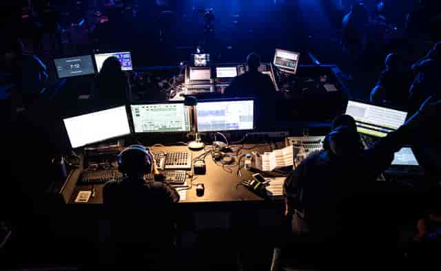 Dynamic control room for live events with screens and equipment at !Audacious Conferencing.