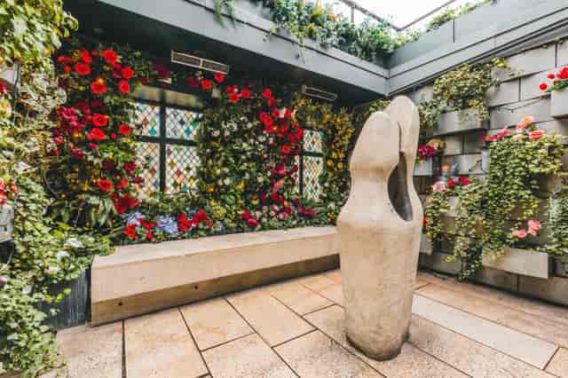 The Loft at The Ivy Club: vibrant floral walls, ideal for events and gatherings.