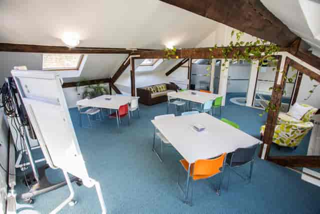 Versatile meeting space with colorful seating for creative workshops at Wallacespace St Pancras.