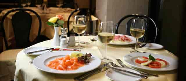 Elegant dining table with gourmet food for corporate dinner in Bolton's restaurant.