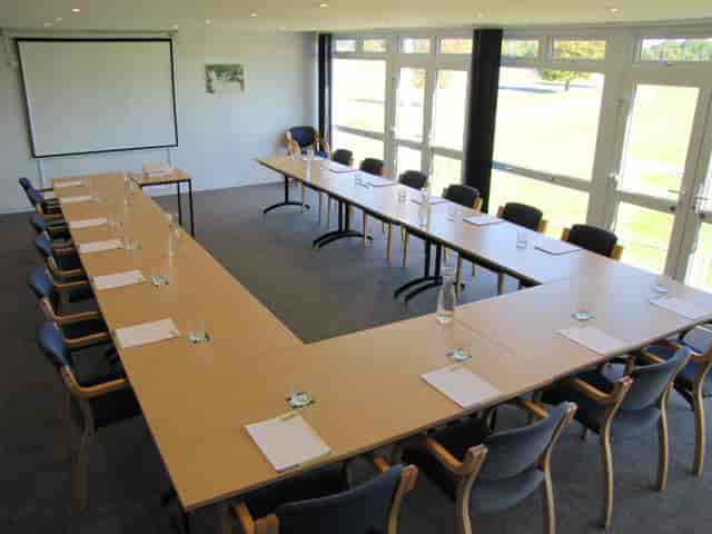 Lindfield Room setup for professional meetings with U-shaped table and natural light.