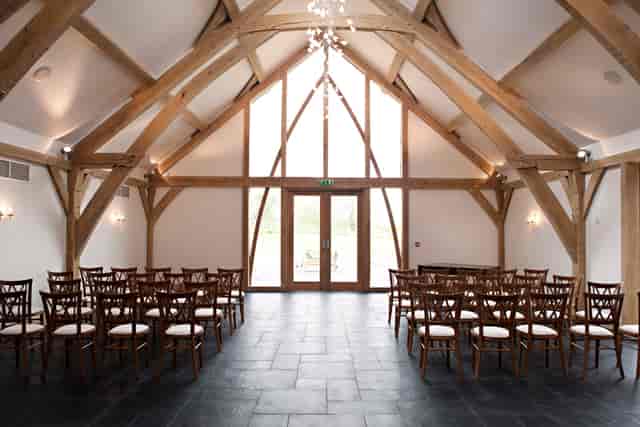 Rustic Oak Barn event space with wooden beams, perfect for intimate ceremonies and workshops.