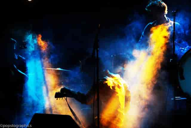 Dynamic live performance at Whole Venue, Nambucca with colorful lighting and smoke.