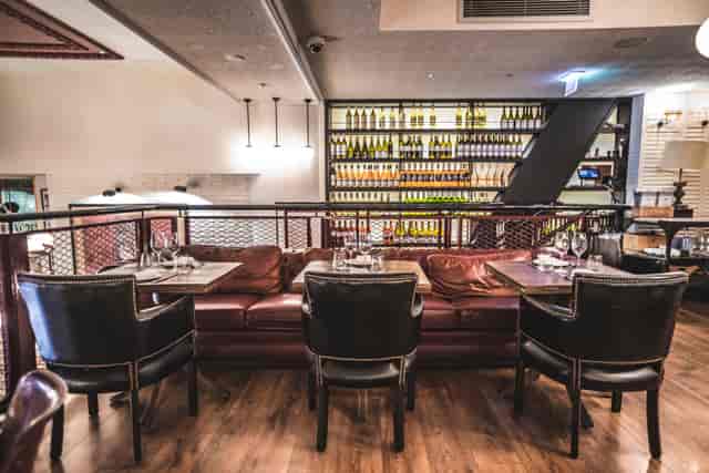 Sophisticated booth seating at Iberica Canary Wharf for high-end networking and private dining.