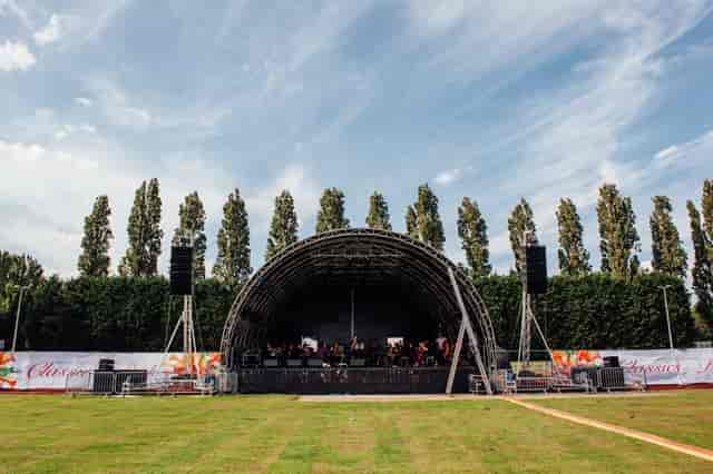 Athletics track in Wimbledon Park with stage, ideal for concerts and festivals.