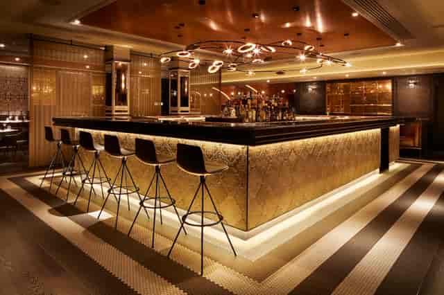 Modern bar with elegant lighting, ideal for networking events and cocktail receptions.