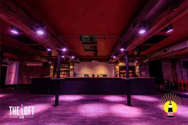 Upstairs at The Lighthouse: industrial-chic event space with bar for gatherings and networking.