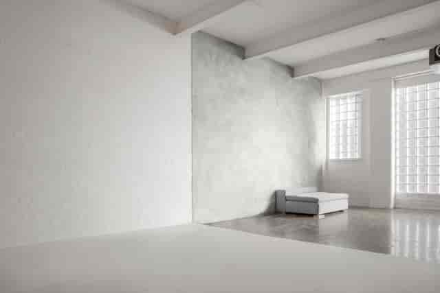 Versatile minimalist event space with natural light at FiveFour Studios for workshops and meetings.