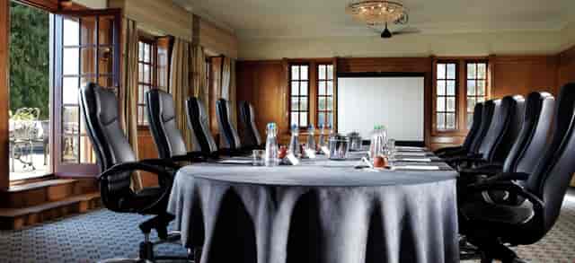 Meeting room at Parkview, Pennyhill Park with round table and natural light for events.
