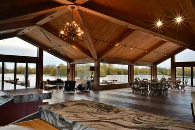 Elegant event venue at Amber Lakes with large windows and scenic water views.