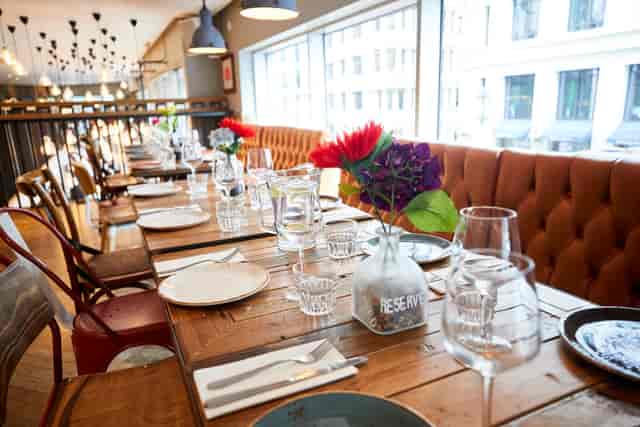 Elegant dining space with wooden table, ideal for events and gatherings at The Hydrant.