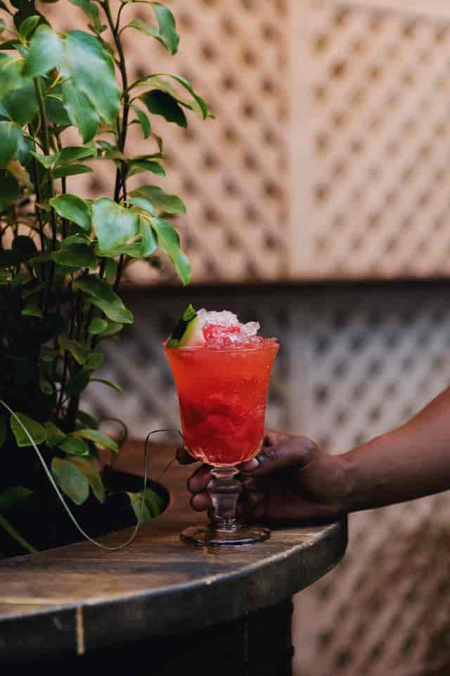 Vibrant cocktail with fresh fruit garnish for events and celebrations at Martello Hall.