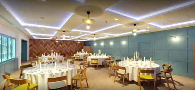 Elegant event space in The Great Hall with round tables, ideal for formal gatherings.