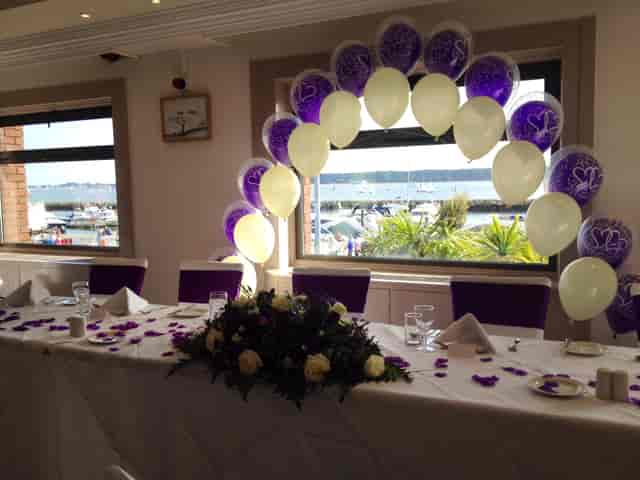 Harbour View Restaurant event space with purple balloon arch, ideal for celebrations.