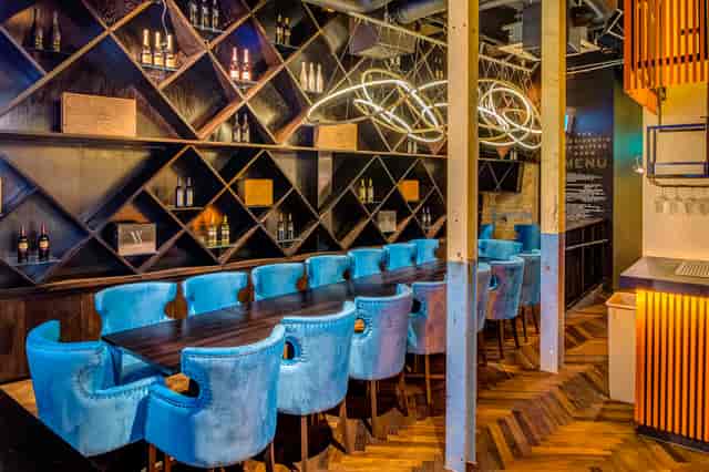 Elegant meeting room with plush blue chairs, perfect for corporate events and gatherings.