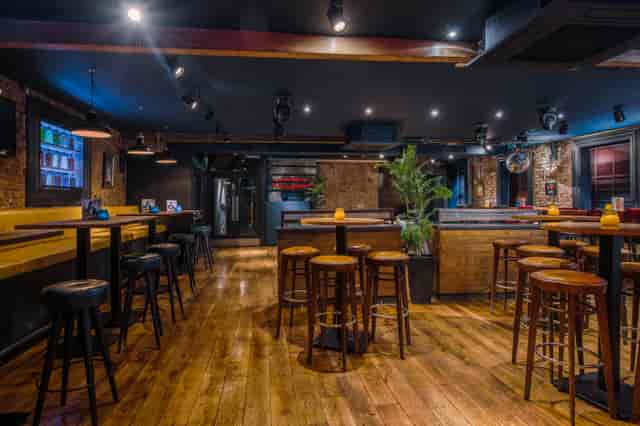 Versatile event space with wooden flooring in The Loft, Revolution Oxford Road, Manchester.