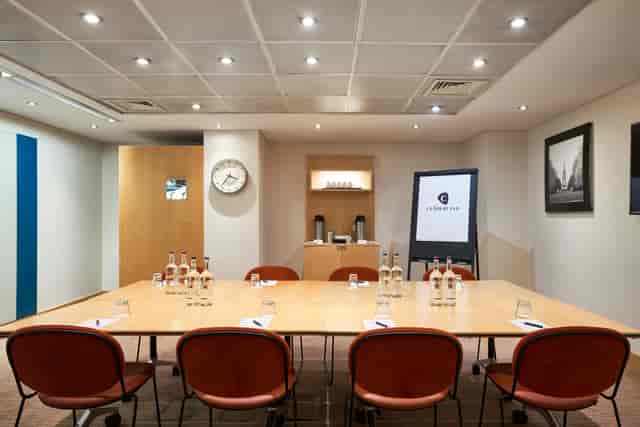 Meeting room at The Cumberland Hotel with spacious table, ideal for corporate events.