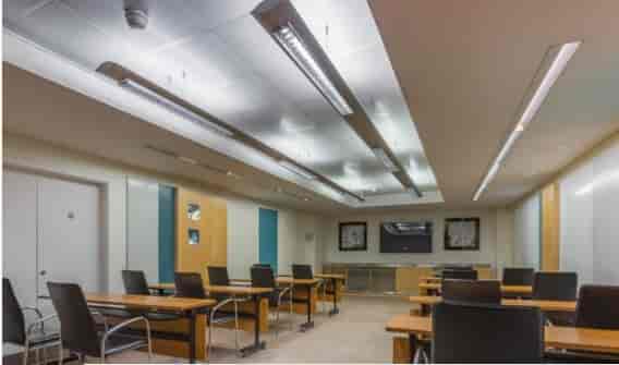 Modern meeting room at The Cumberland Hotel, featuring ergonomic chairs and tech setup.
