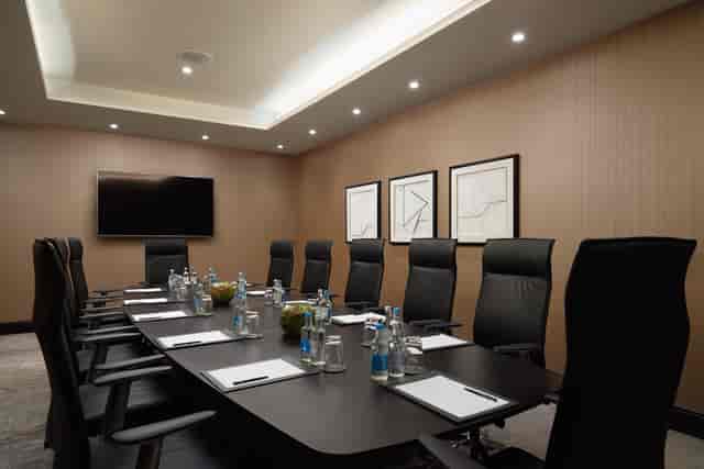 Blackfriars Boardroom at Hilton London Bankside, modern meeting room with sleek decor.