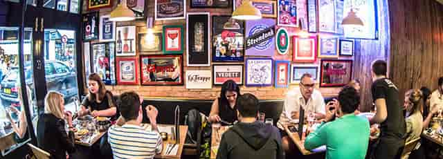 Informal networking breakout at The Caves, Belgo Soho with vibrant decor.