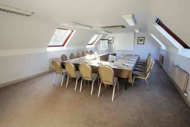 Milan Suite meeting room with skylights, ideal for workshops and conferences.