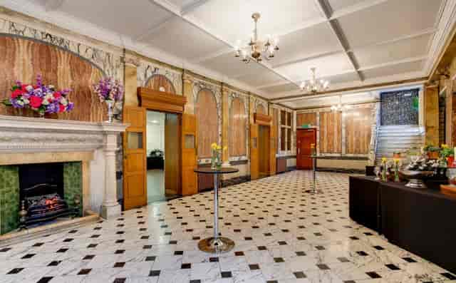 Elegant Marble Hall with tiled floor, ideal for receptions and networking events.