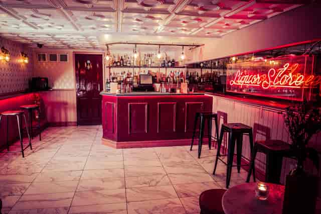 Stylish bar area in Simmons Function Room, ideal for networking events and gatherings.