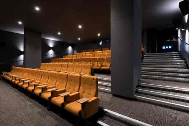 Curzon Aldgate Cinema Screen 2 with tiered orange seating for events and screenings.