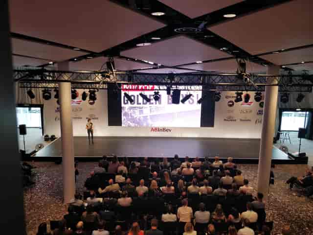 Bobby Moore Room at Wembley Stadium, featuring a speaker and engaged audience for conferences.
