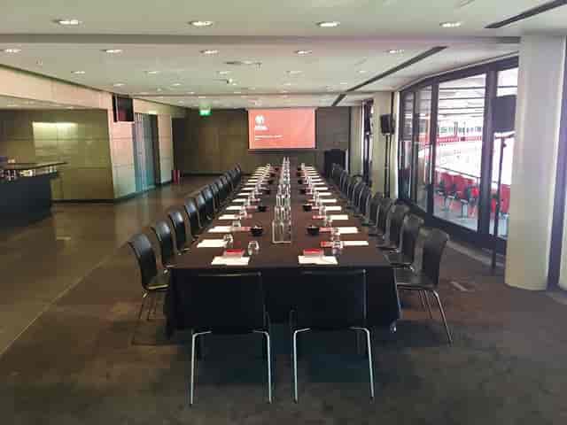 Pitch View Room at Wembley Stadium, modern corporate meeting space with natural light.