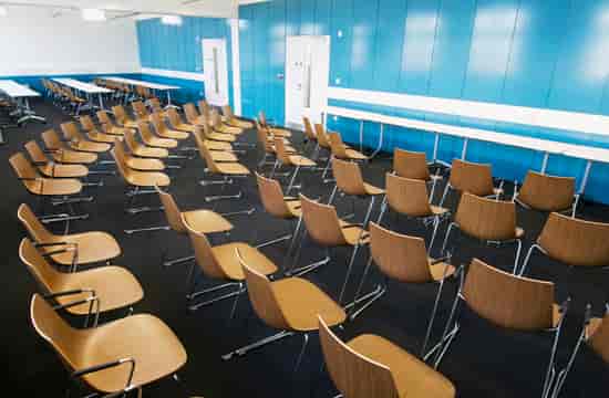 Bloom Suite meeting space with modern chairs, ideal for presentations and workshops.