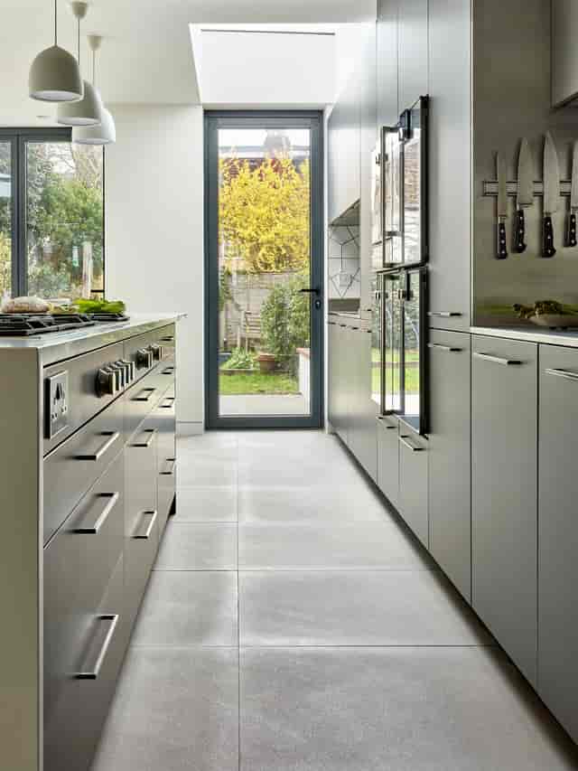 Modern kitchen with ample counter space for culinary events and cooking classes.