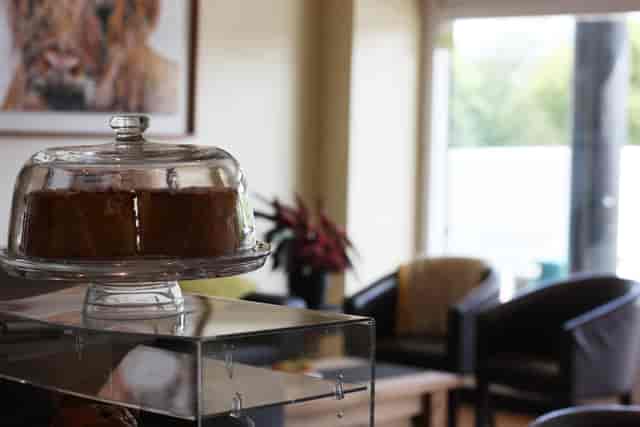Inviting meeting space at Rossi's Coffee Shop with natural light for networking events.