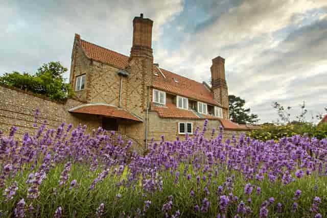 Charming Voewood gardens with vibrant lavender, perfect for outdoor weddings and events.