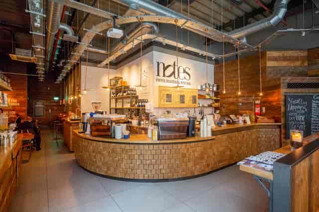Modern café with wooden accents, perfect for networking events and informal meetings.