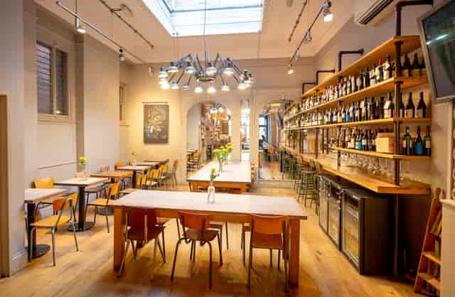 Stylish event space with warm wood tones, ideal for corporate meetings and private dinners.