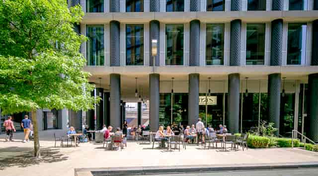 Vibrant outdoor seating at Notes Kings Cross for casual meetings and networking events.