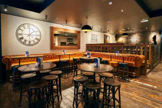 Stylish venue with rustic decor for casual meetings and events at The Running Horse.