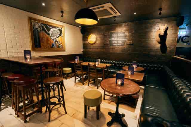 Cozy venue with warm lighting for networking events and cocktail receptions.