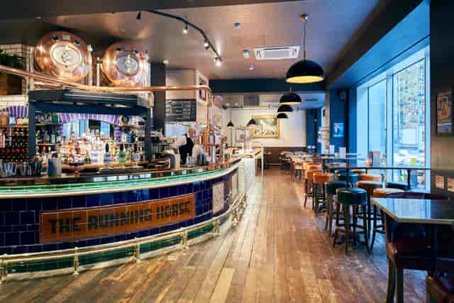 Stylish bar setting in The Running Horse, perfect for networking events and meetings.