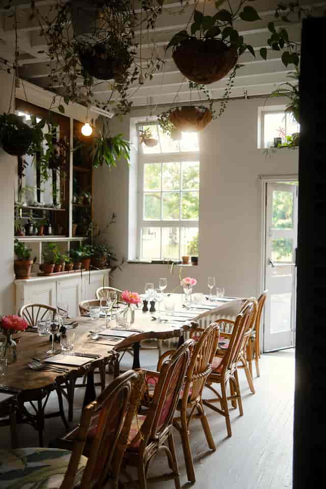 Private dining room with rustic table setup for intimate gatherings and corporate retreats.